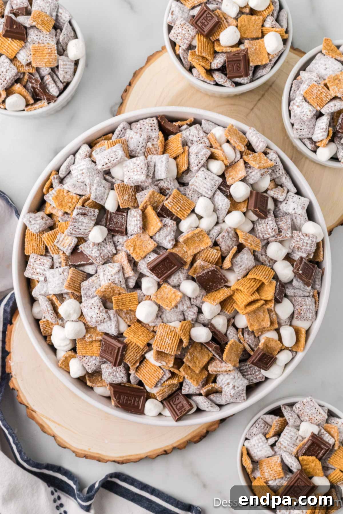 Smores Indulgence Mix 2 Bowls of S'mores Puppy Chow ready to enjoy, perfect for sharing at parties or movie nights.