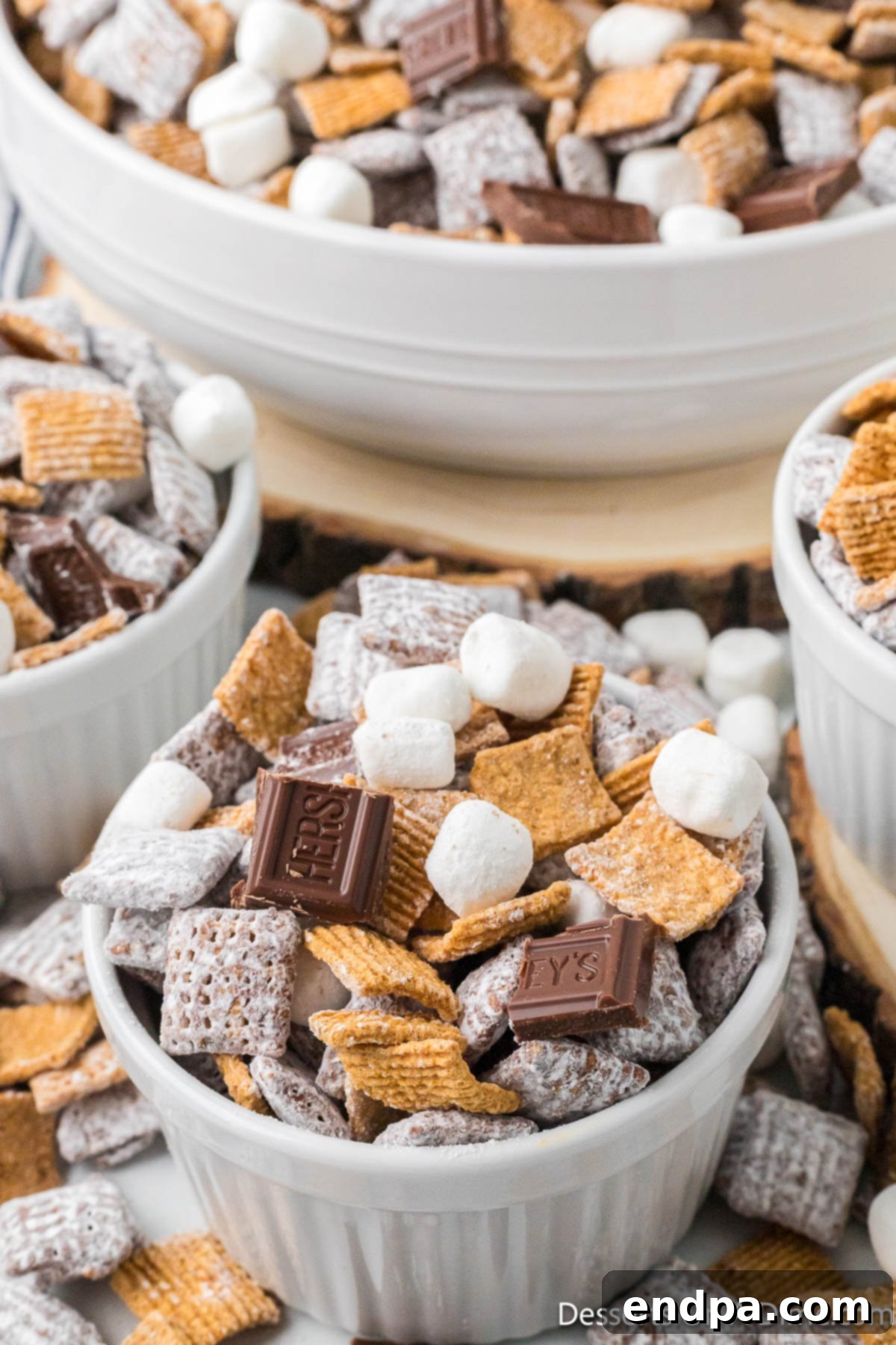 Smores Indulgence Mix 12 A large white bowl brimming with freshly made S'mores Puppy Chow, ready to be enjoyed.
