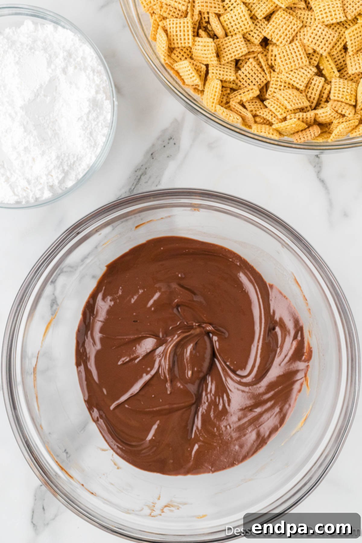 Smores Indulgence Mix 5 Smooth, melted chocolate and peanut butter mixture in a bowl, perfectly blended.