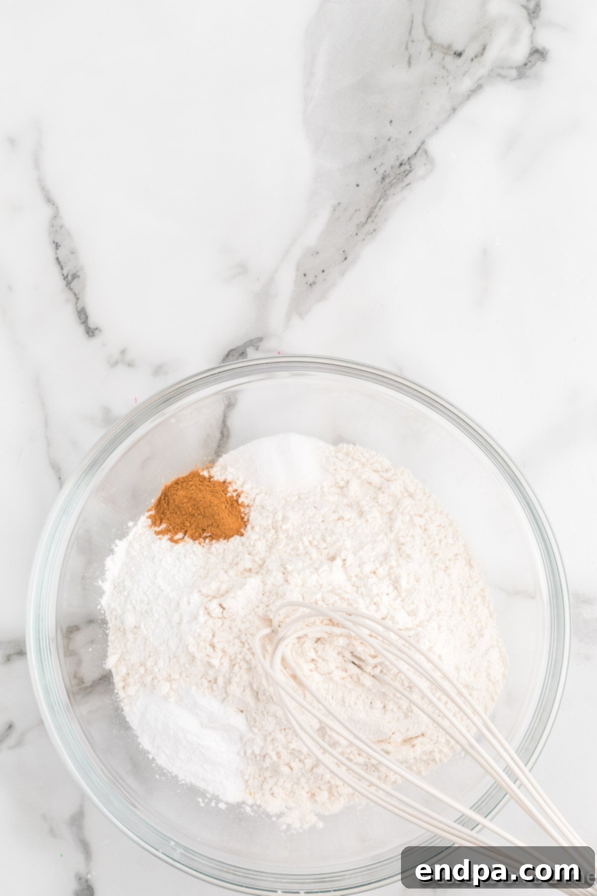 Festive Frontier Cookies 4 Combining the dry ingredients in a bowl: flour, baking soda, baking powder, cinnamon, and salt.