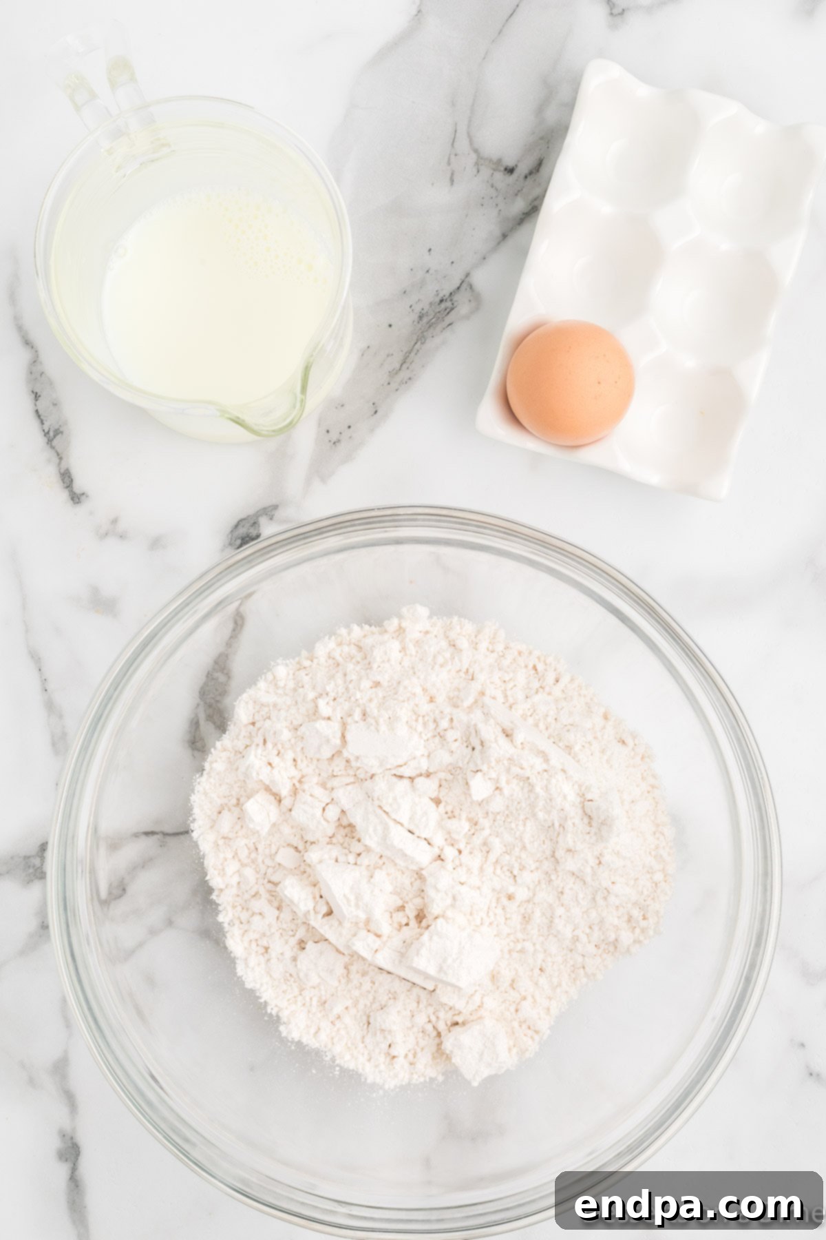 Pancake mix poured into a large mixing bowl, ready for batter preparation.
