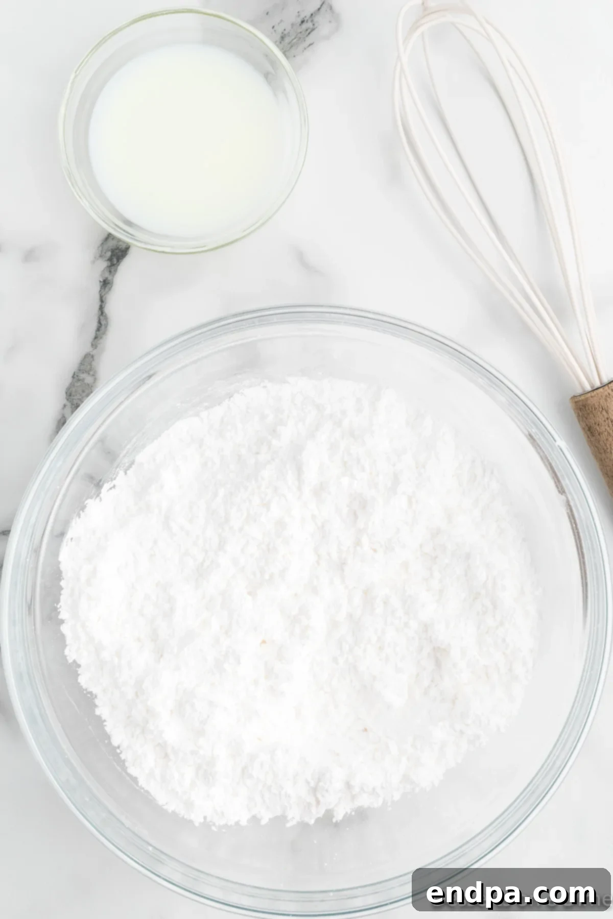Dry ingredients in a bowl, showing flour, baking soda, and salt mixed.