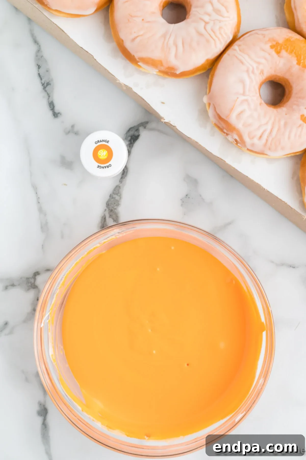 Spooky Delicious Halloween Donuts 5 Orange gel food coloring mixed into white frosting.