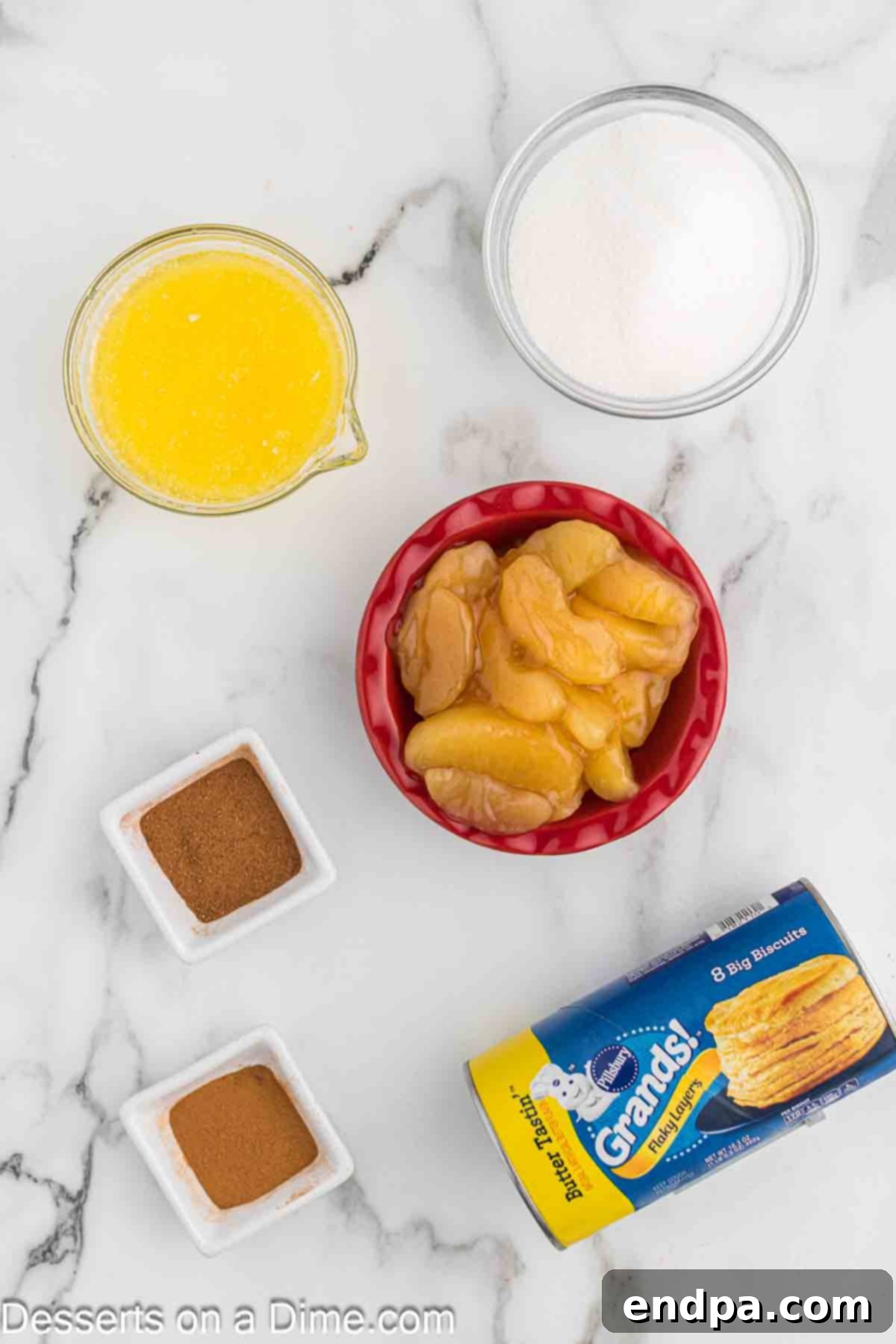 Air Fryer Apple Pie Bites 3 Ingredients needed: canned biscuits, granulated sugar, apple pie spice, apple pie filling, ground cinnamon, and melted butter.