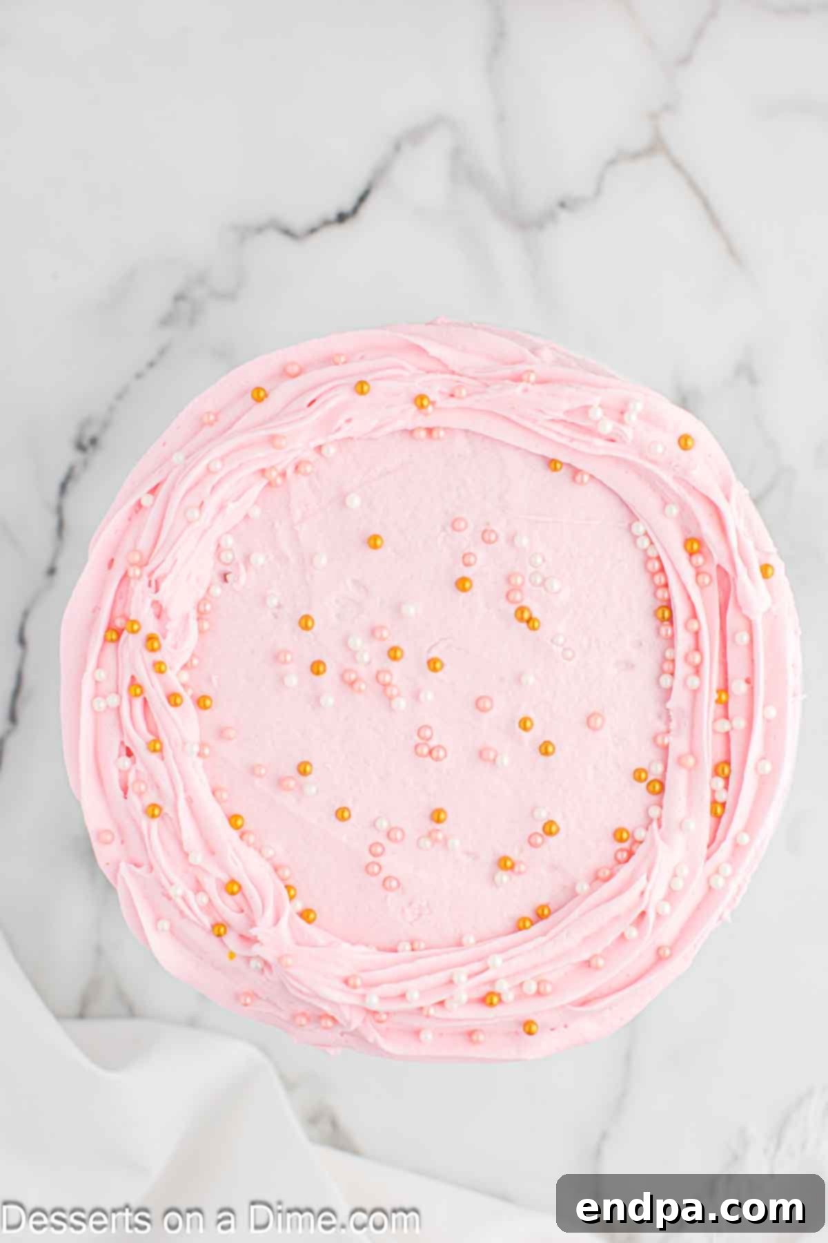 Cake decorated and topped with sprinkles.