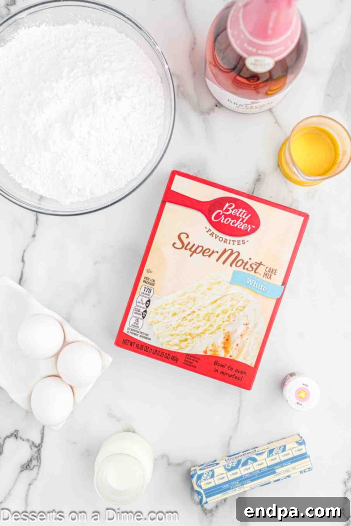 Ingredients for cake - cake mix, eggs, butter, oil, powdered sugar, pink food coloring, pink champagne.