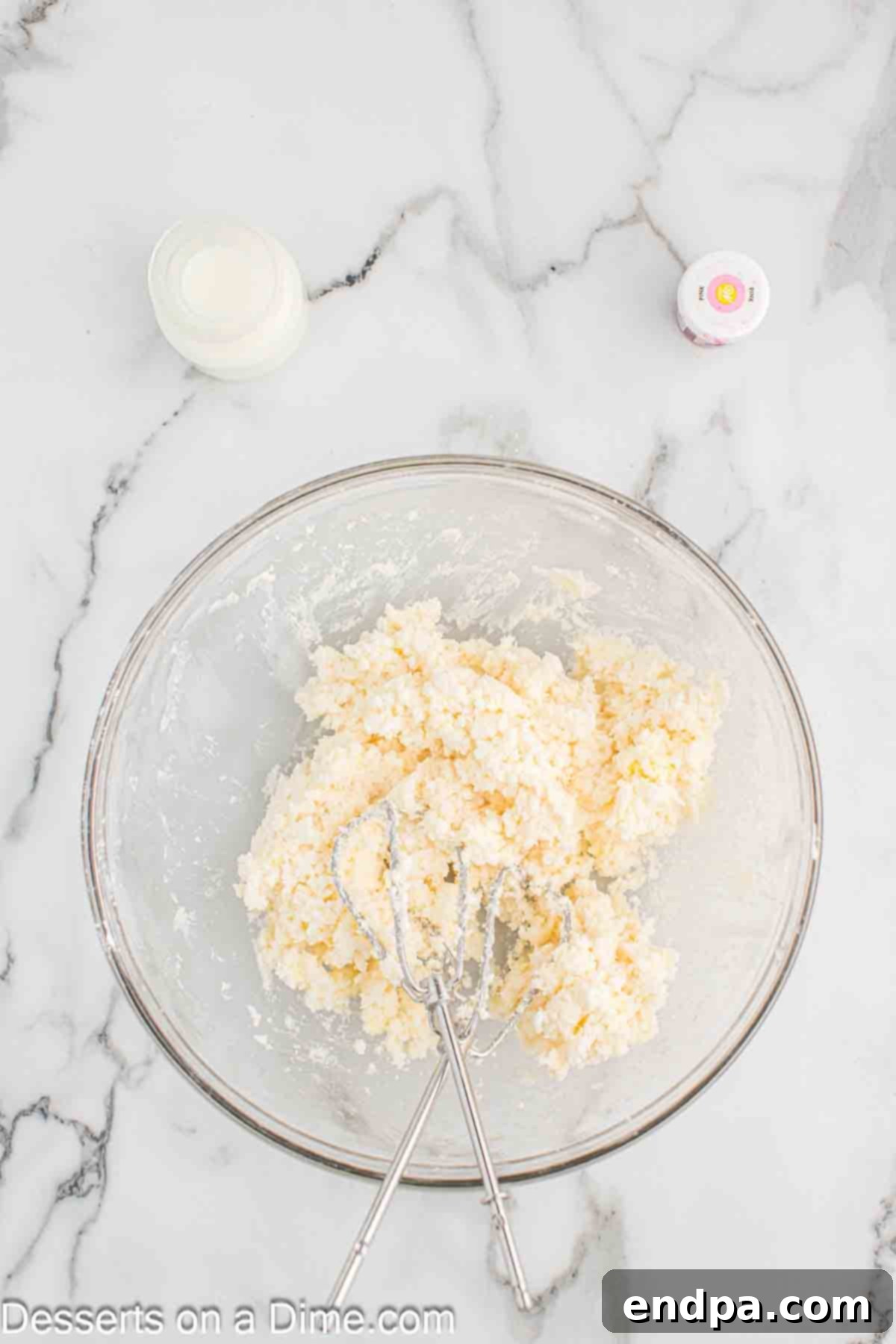 Butter and sugar mixed together in a bowl.