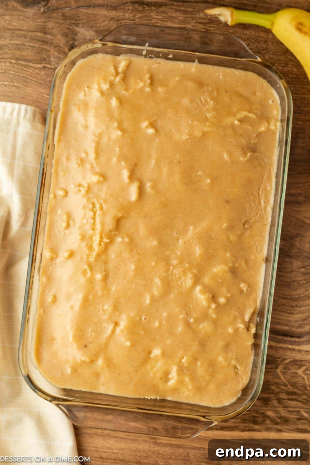 Decadent Banana Bread Brownies 11 Brownies topped with frosting.