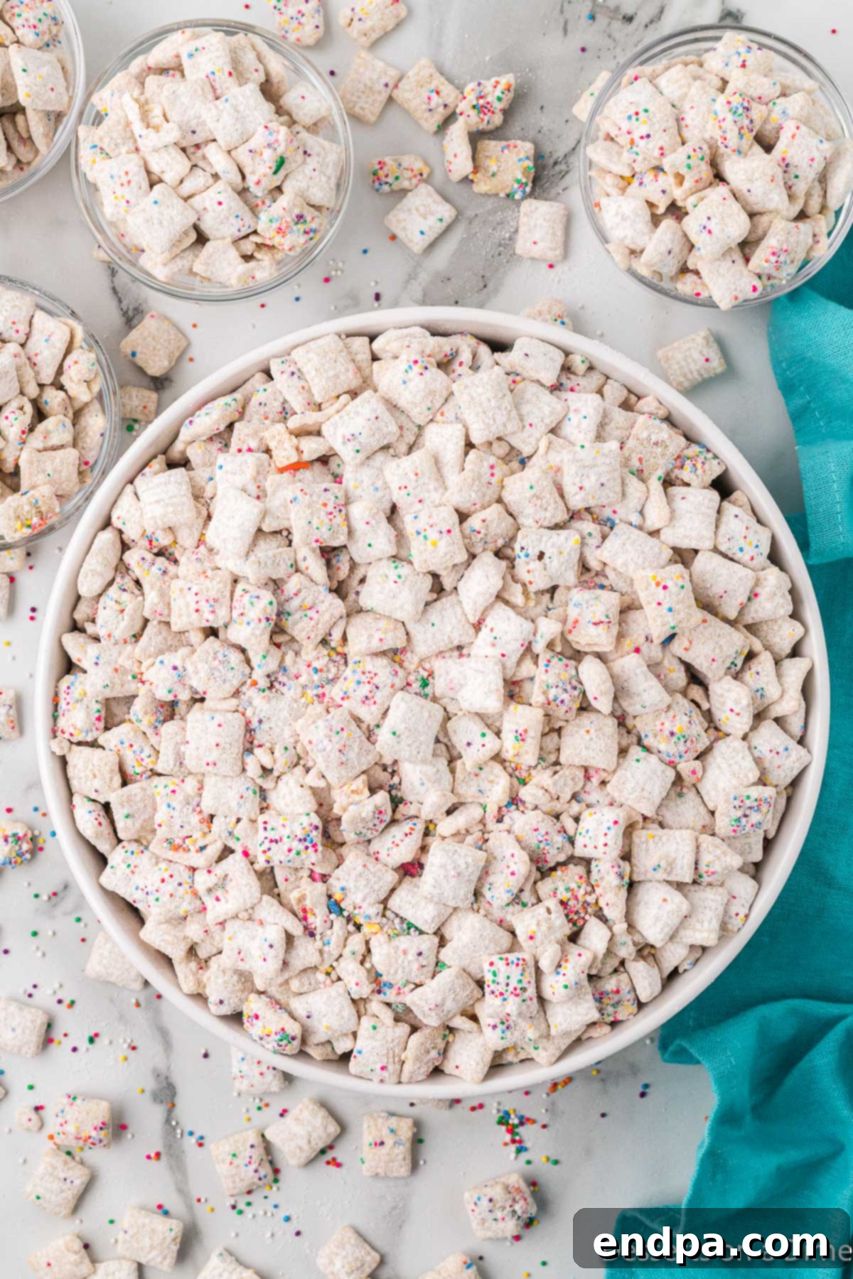 Festive Funfetti Snack Mix 2 Funfetti Puppy Chow in a large white bowl, ready to be served