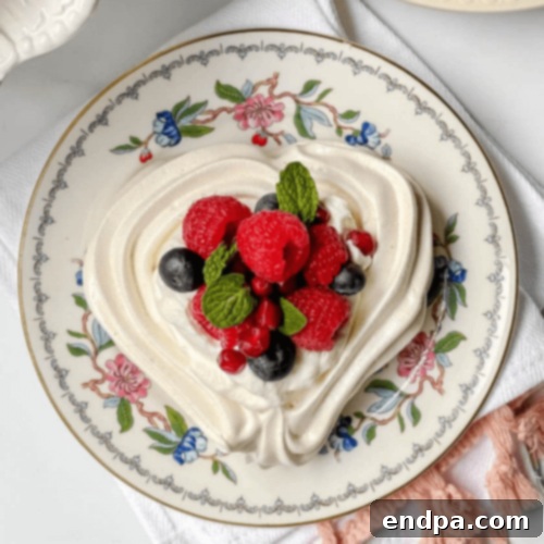 Heart Shaped Pavlova with whipped cream and fruit