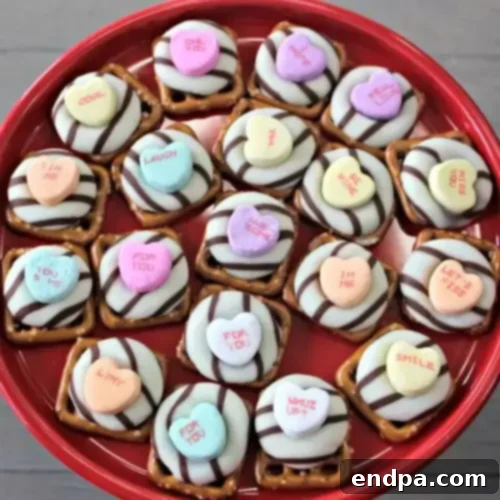 Valentine’s Day White Chocolate Pretzel Kisses with candy hearts