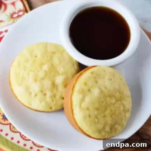 Various Pancake Muffins with different toppings in a muffin tin.