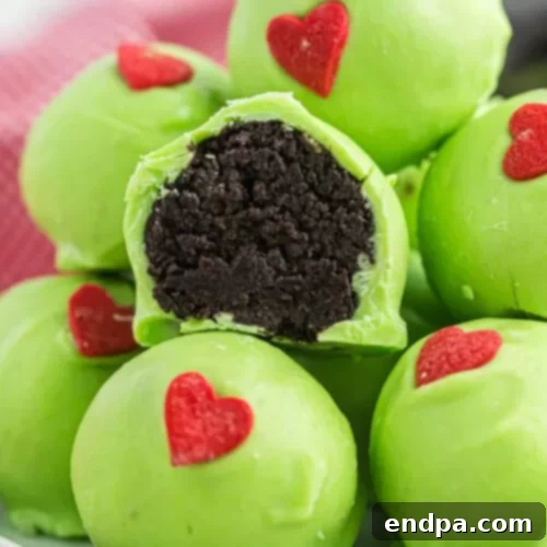 Green Grinch Oreo Balls with a red heart