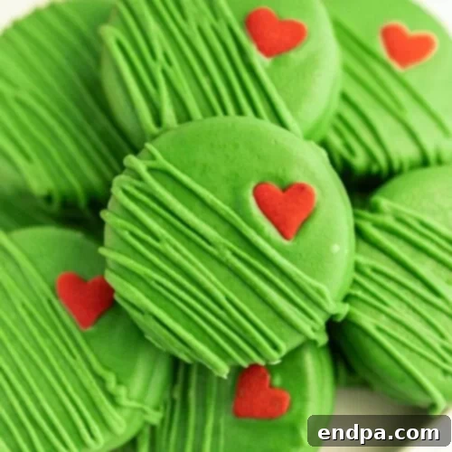 Grinch-themed Chocolate-Covered Oreos with a red heart