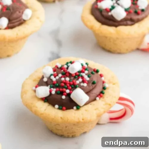 Hot Chocolate Cookie Cups with fudge, sprinkles, and marshmallows