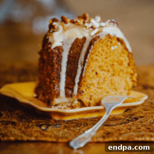 Pumpkin Spice Bundt Cake with Brown Sugar Glaze and chopped pecans.