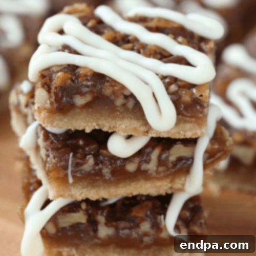 Spiced Honey Pecan Pie Bars with white chocolate drizzle.