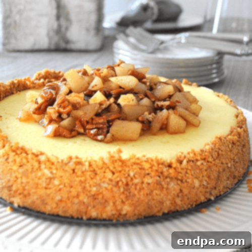 Pear Maple Pecan Cheesecake with maple drizzle and whole pecans.