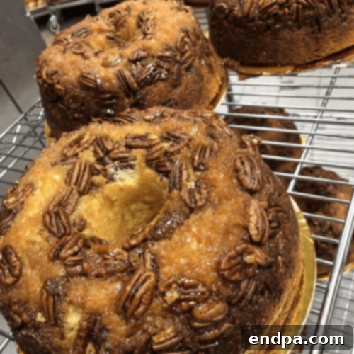 Upside Down Georgia Pecan Cake, garnished with more pecans.