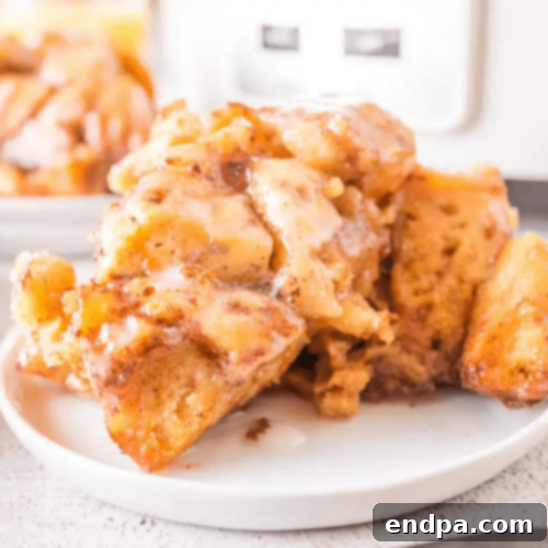 Slow-Cooker Cinnamon Roll Casserole in a crockpot, ready to serve.