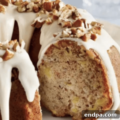 Hummingbird Bundt Cake with cream cheese glaze and pecans.