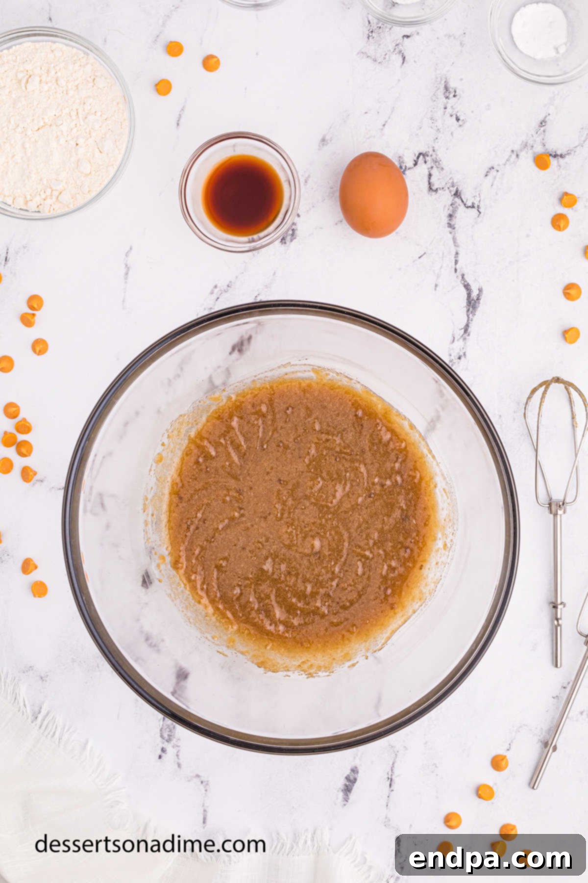 Maple Caramel Blondie Bars 5 Butter and sugar mixed together with eggs and vanilla in a bowl.