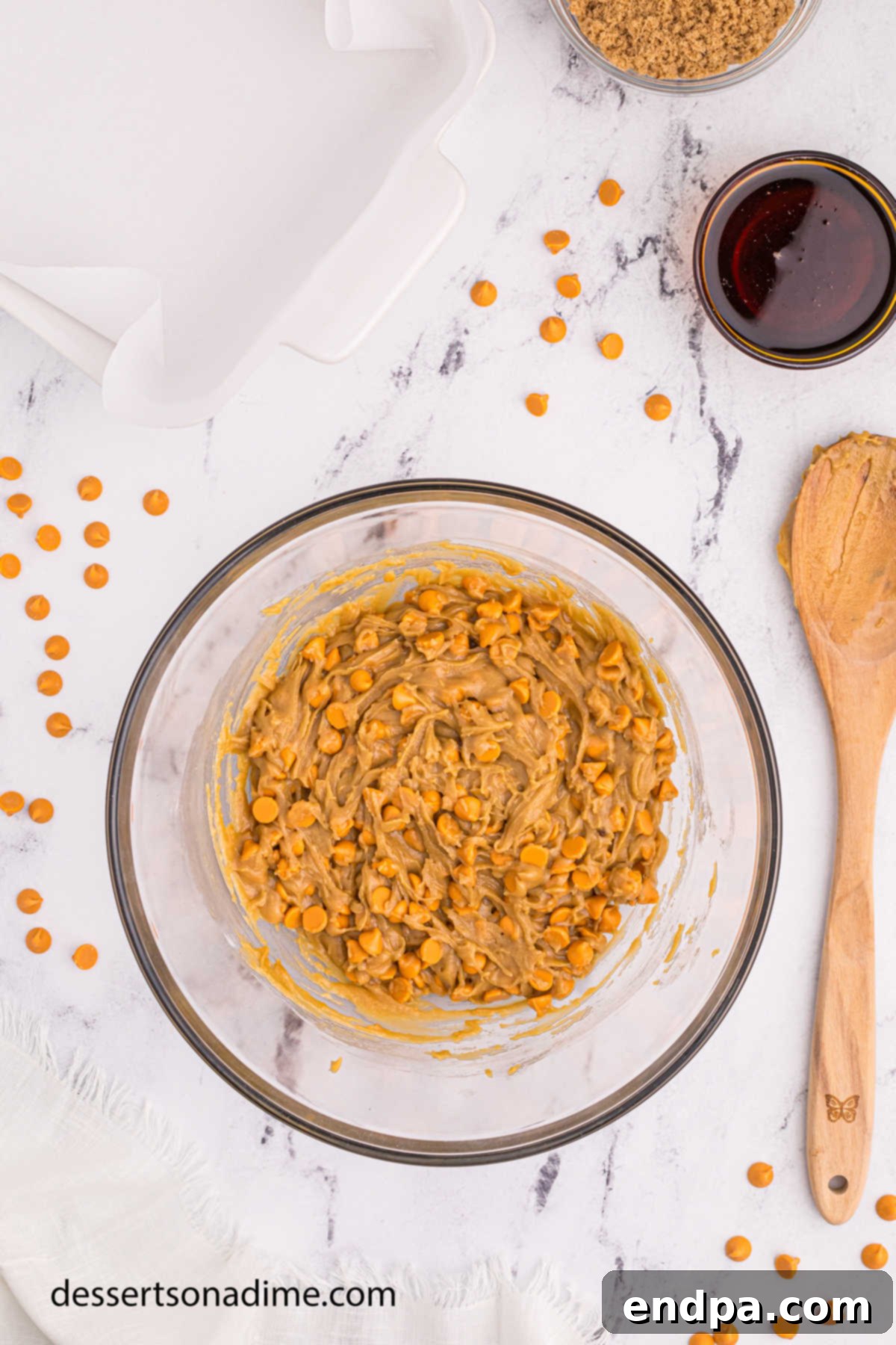 Maple Caramel Blondie Bars 9 Butterscotch chips folded into bowl.