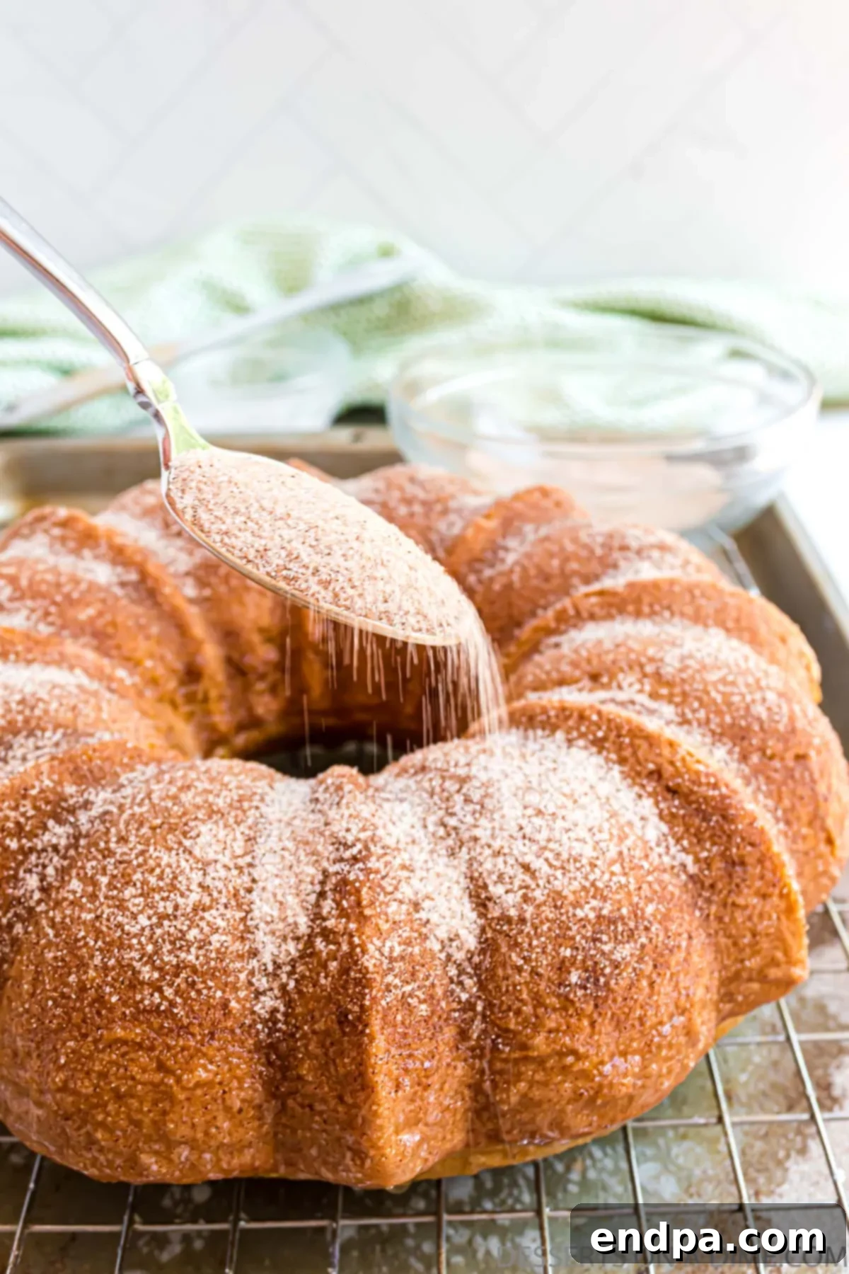 Autumn Apple Cider Bundt 11 Topping sprinkled on cake.