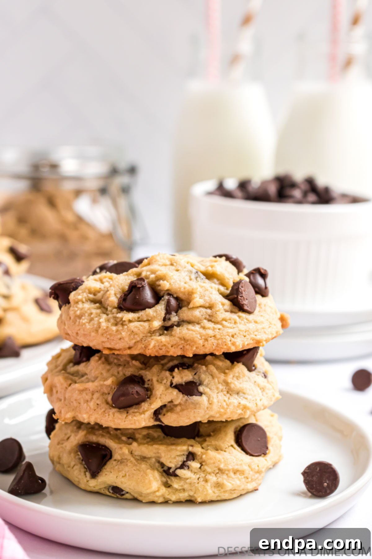 Stacked cream cheese chocolate chip cookies, showcasing their soft, chewy texture and visible chocolate chips.