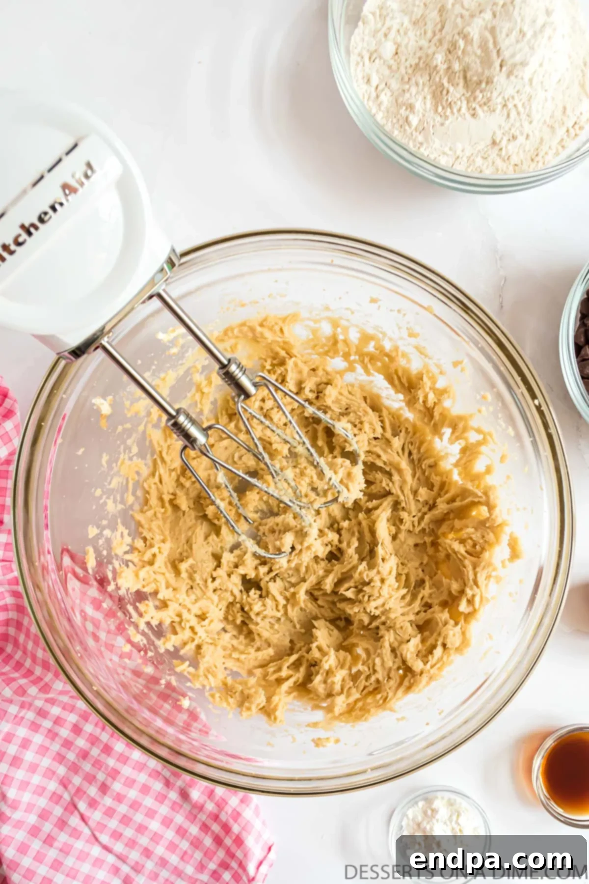 Softened butter, cream cheese, and sugars combined in a mixing bowl.