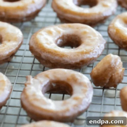 Golden-brown Cake Donuts with a light glaze, a classic homemade treat.