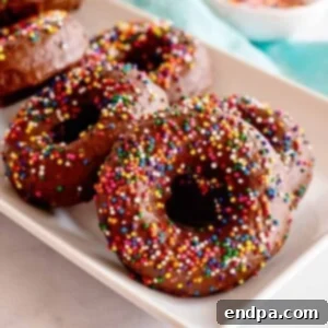 Chocolate Frosted Donuts with sprinkles, a delightful and easy homemade dessert.