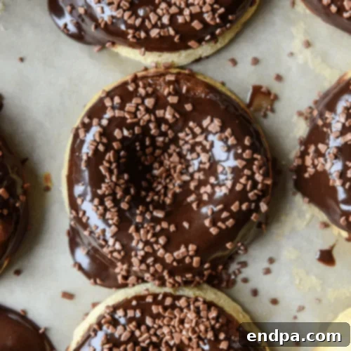 Banana Bread Donuts with a rich Nutella glaze, a sweet and fruity treat.