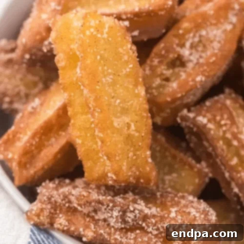 Copycat Disney Churros coated in cinnamon sugar, a magical treat.