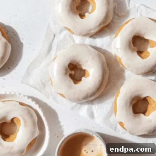 Vanilla Chai Doughnuts with glaze, a flavorful and aromatic treat.
