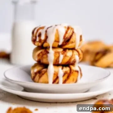 Cinnamon Roll Donuts with cream cheese icing, a delightful fusion dessert.