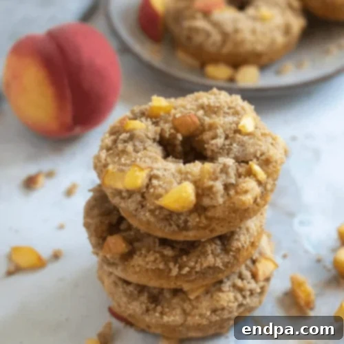 Peach Crisp Whole Wheat Donuts with a crumble topping, a healthy summer treat.