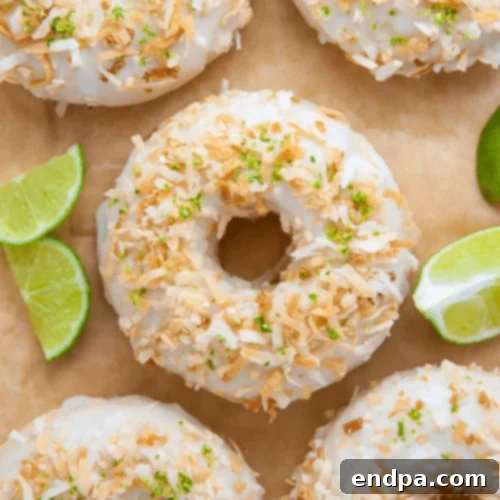 Key Lime Coconut Donuts, baked and topped with a refreshing key lime glaze.