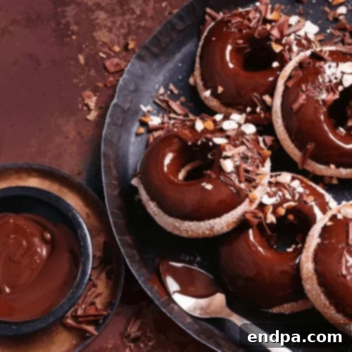 Baked Buttermilk Doughnuts with a luscious whisky chocolate glaze, elegantly presented.