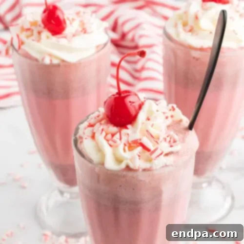 A refreshing Chick-fil-A Peppermint Milkshake, topped with whipped cream and crushed candy canes.