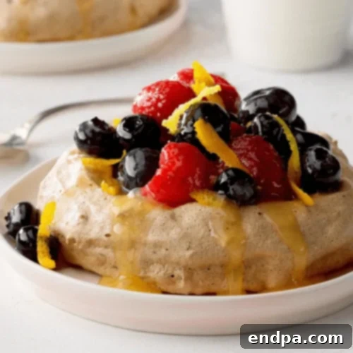 Delicate Cocoa Meringues, paired with a vibrant assortment of fresh berries.