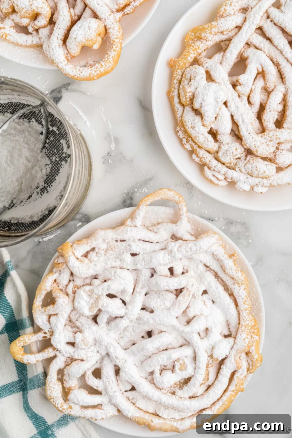 A freshly made funnel cake topped generously with white powdered sugar, served on a white plate, evoking a classic state fair treat.