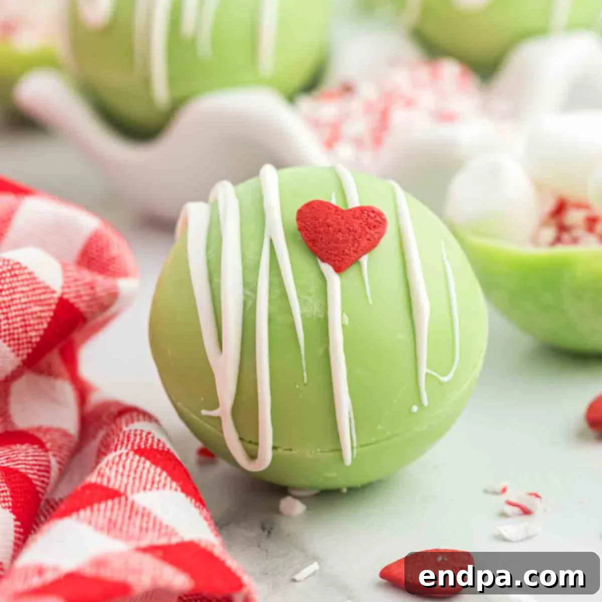 Grinchmas Hot Cocoa Bombs 11 Finished Grinch Hot Chocolate Bombs on display.