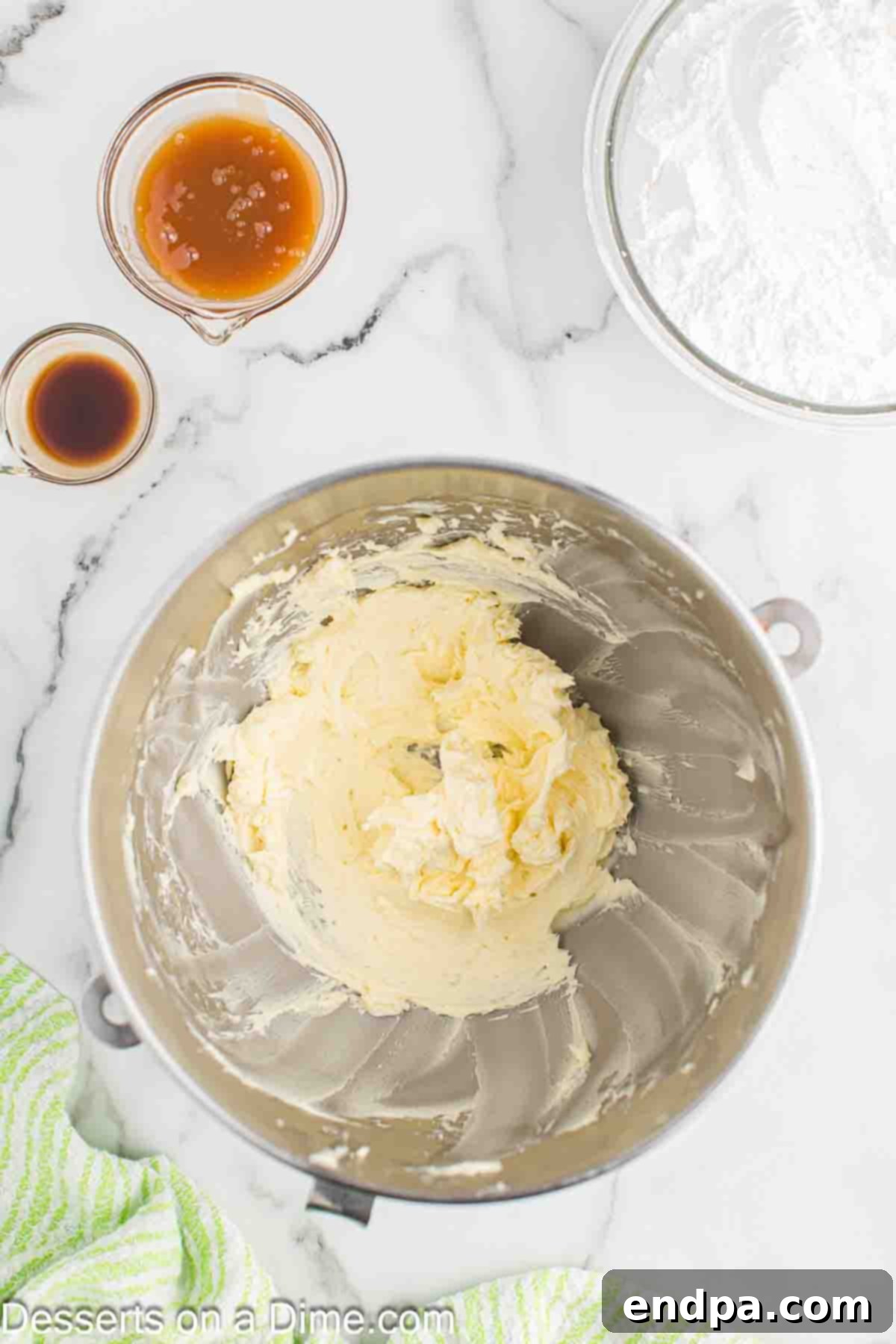 Sticky Caramel Apple Swirl Cupcakes 8 Bowl with softened butter being beaten until light and fluffy.