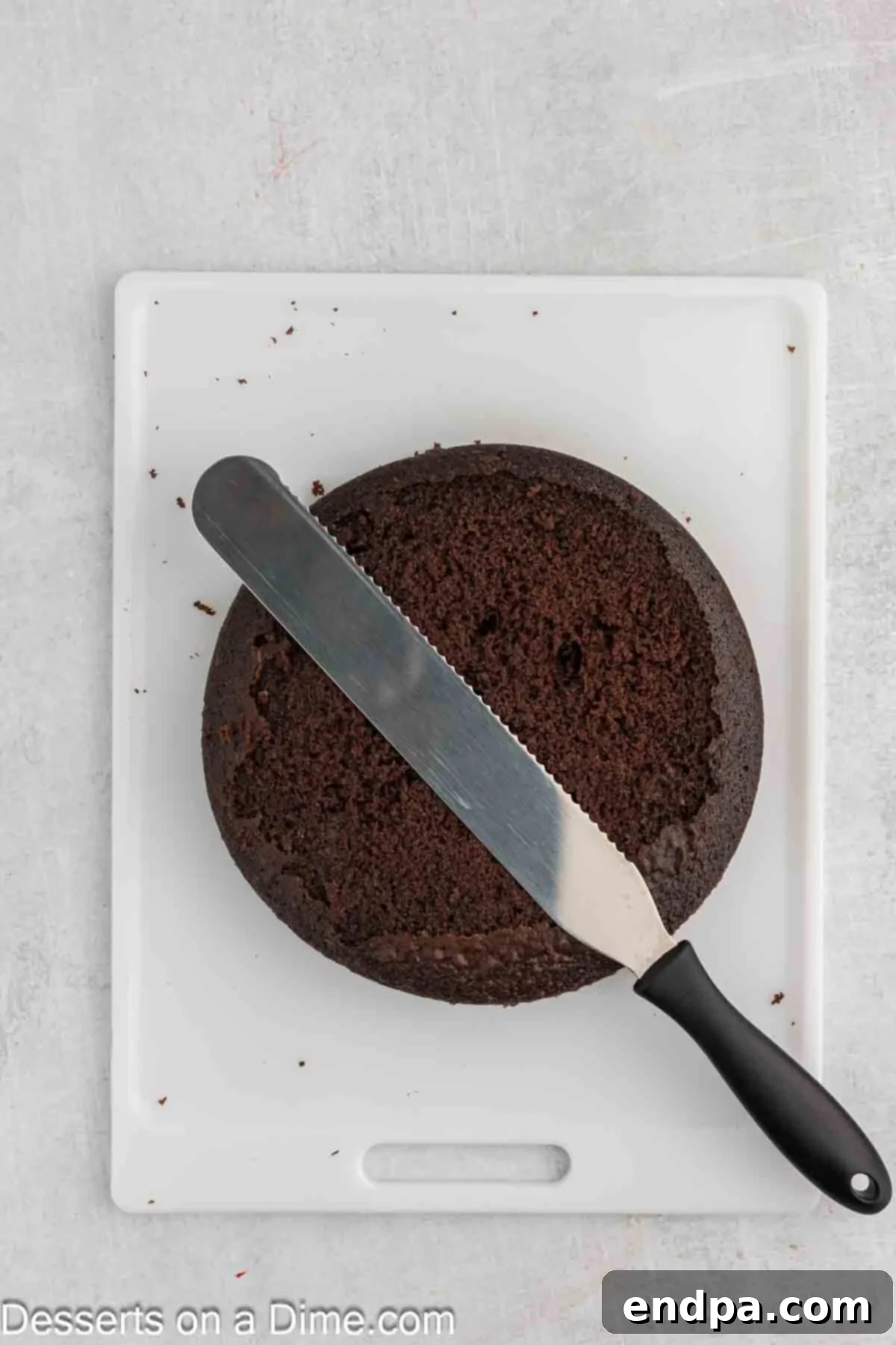 Game Day Goal: Baking a Winning Football Cake 6 Cake being leveled with a knife.