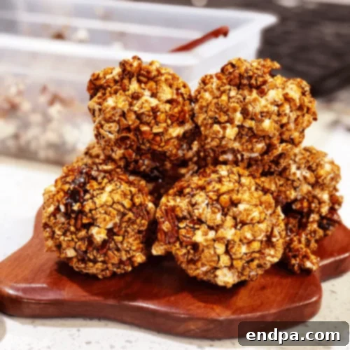 Steen’s Cane Syrup Popcorn Balls, featuring a dark, rich caramel coating.