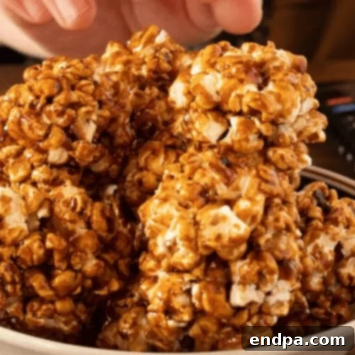 Dark and inviting Molasses Popcorn Balls, a rich, old-fashioned treat.