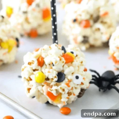 Spooky Marshmallow Halloween Popcorn Balls, perfect for seasonal celebrations.