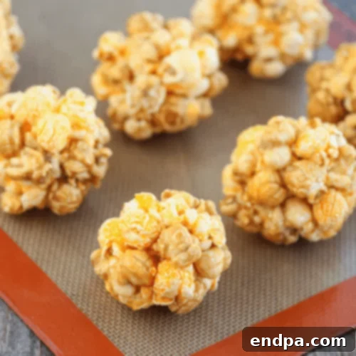 Cheddar Caramel Popcorn Balls, a unique blend of sweet and savory flavors.