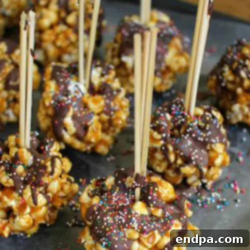 Decadent Chocolate Caramel Popcorn Balls, a sweet and salty indulgence.